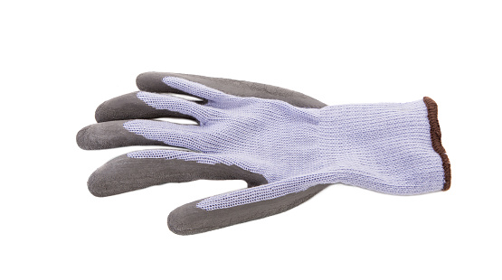 Grey rubberized glove. Isolated on a white background. Close-up.