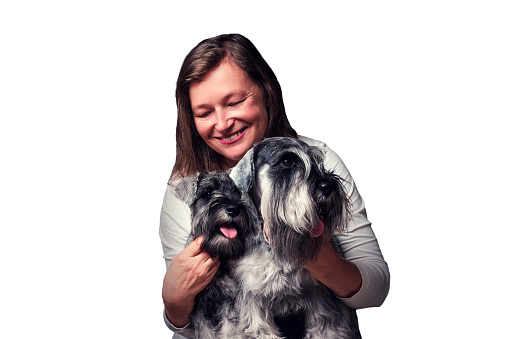 Mature woman with miniature schnauzer dog, isolated on white background