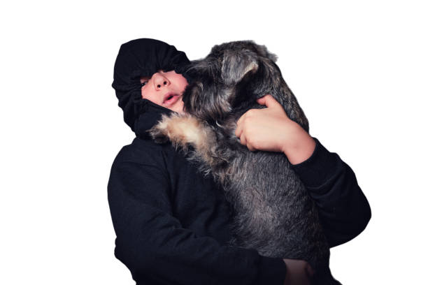istock Child boy hugging his dog, isolated on white background. Studio shot 1726331561