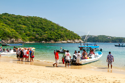 Huatulco, Mexico. August 2nd, 2014. Recreational activities at La Entrega beach in Huatulco, Mexico with view of tourists and service providers.