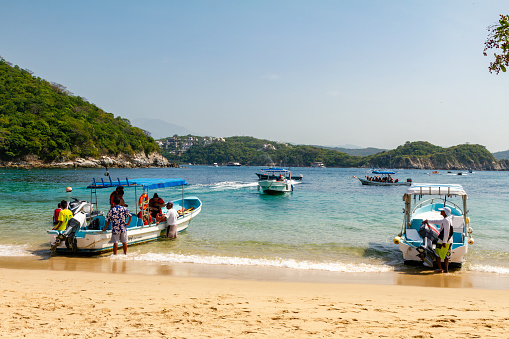Huatulco, Mexico. August 2nd, 2014. Recreational activities at La Entrega beach in Huatulco, Mexico with view of tourists and service providers.