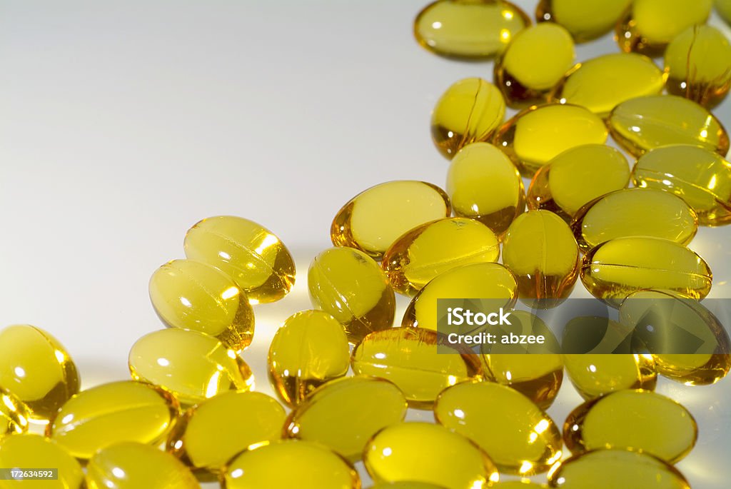 Cod liver oil capules with white space to the left Healthcare And Medicine Stock Photo