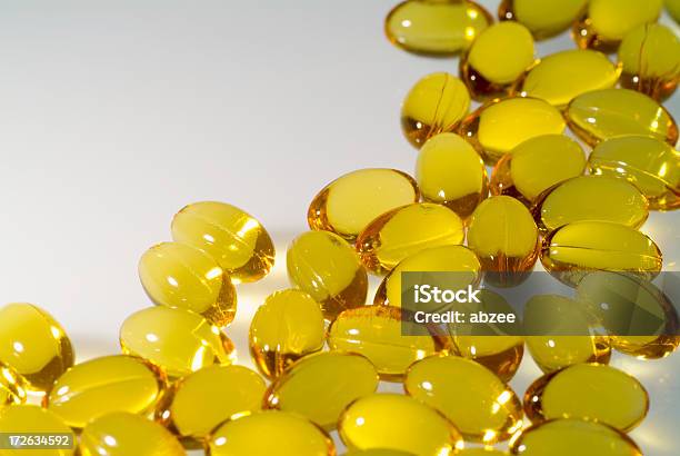 Cod Liver Oil Capules With White Space To The Left Stock Photo - Download Image Now - Healthcare And Medicine, Homeopathic Medicine, Horizontal