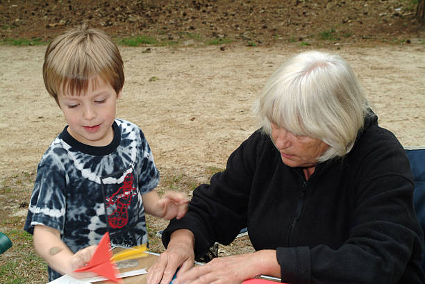 istock Making a paper plane Grandmother and grandson 172634661