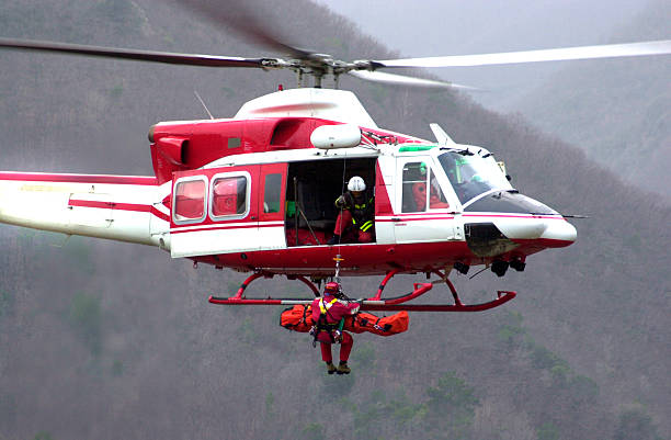 Rescue Helicopter II Emergency helicopter at work cable winch stock pictures, royalty-free photos & images