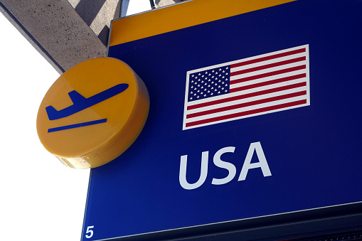 Airport sign depicting USA destinations.