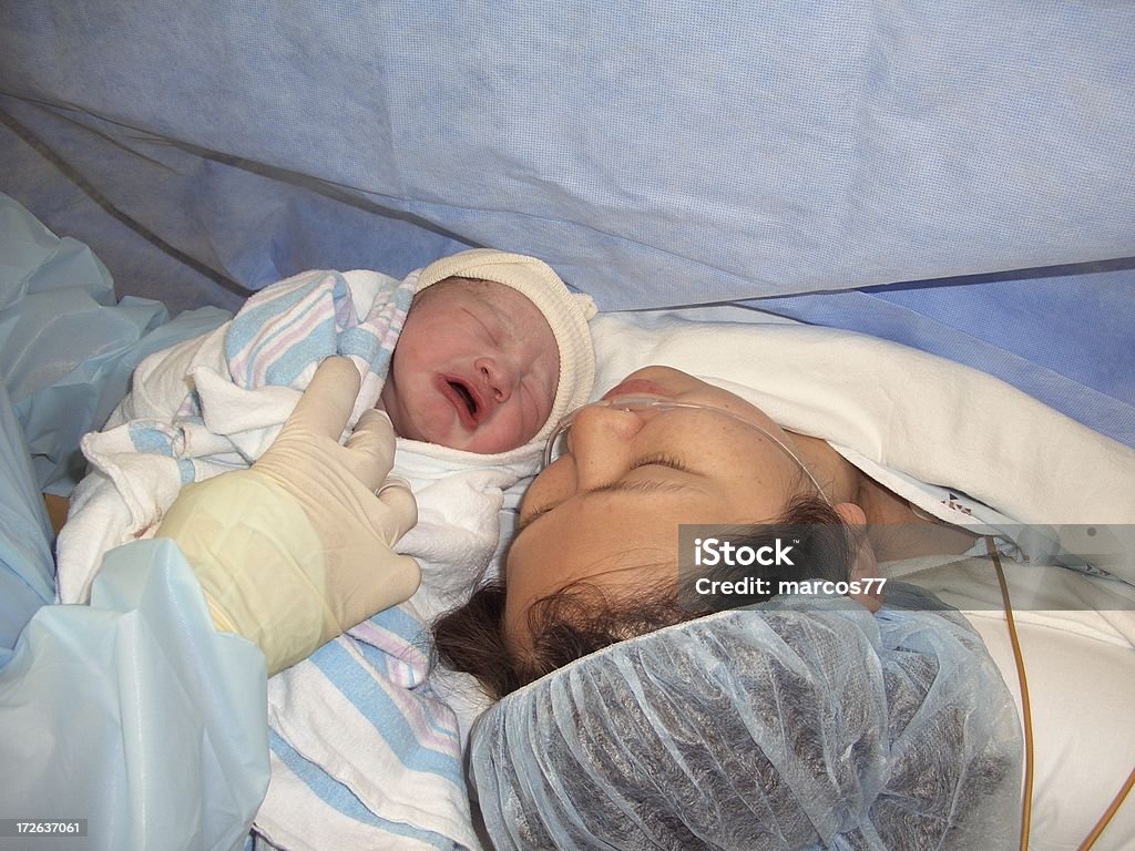 Childbirth Baby boy just delived from cesarean Caesarean Section Stock Photo