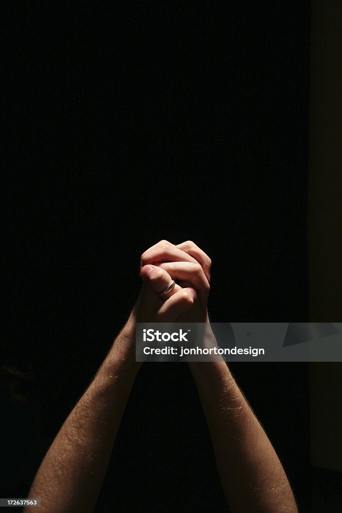 Praying Hands Two hands clasped together in prayer. Asking Stock Photo