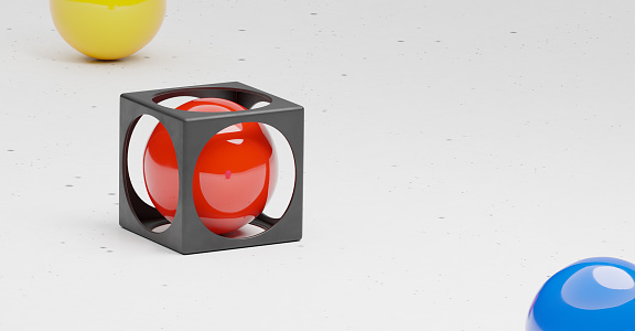 A red sphere in a black cage sitting on sleek white table