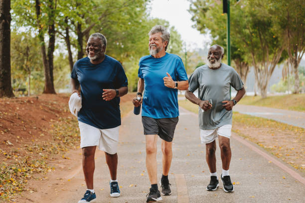 istock Three elderly friends running together in public park 1726383140