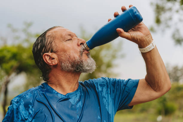 istock Portrait of a senior man drinking water exercising 1726383479