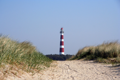 Nice composition of big lighthouse just in between some nice dunes.