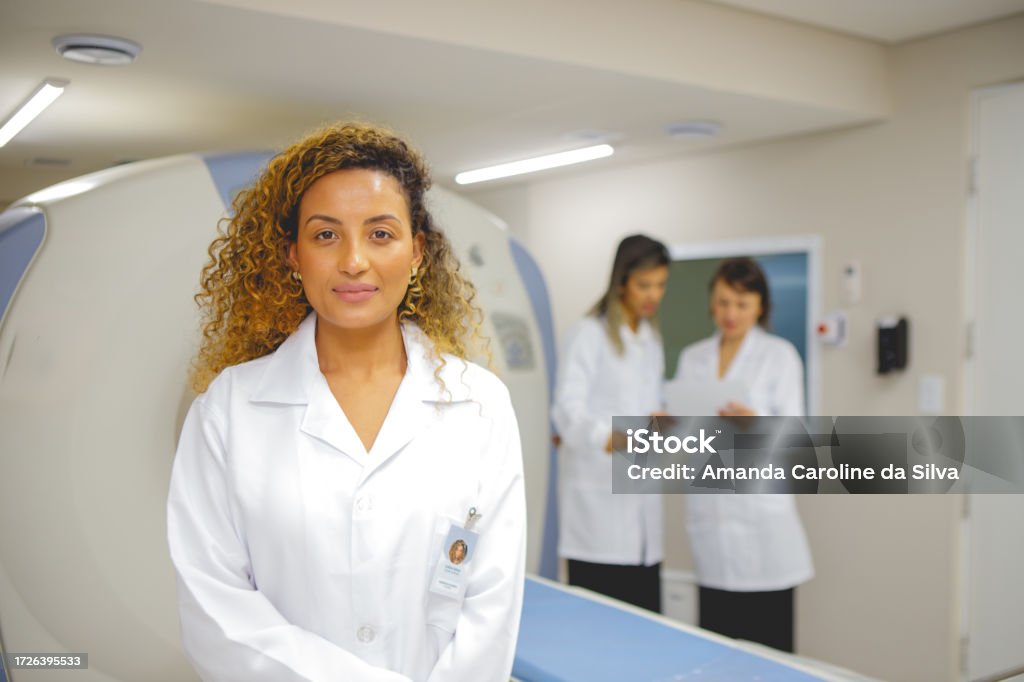 portrait of doctor in front of magnetic resonance imaging machine MRI Scan Stock Photo