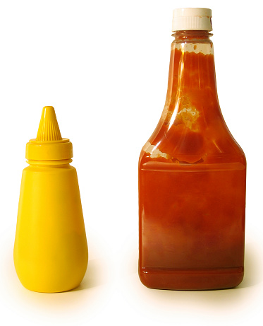 Isolated bottles of Ketchup and Mustard.