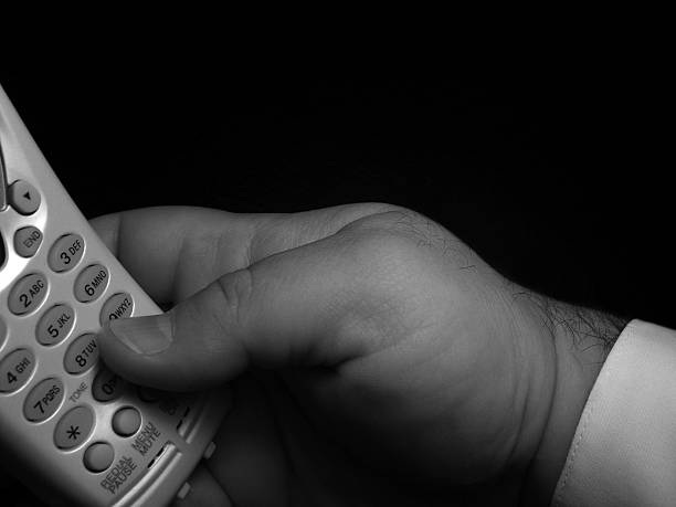 Dialling-2 A black and white photo of dialling process dialling phone stock pictures, royalty-free photos & images