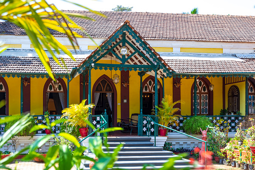 5th January, 2021 - Goa, India: The Casa Oliveira Mansion, a historical gem located in Goa, serves as the setting for these editorial images. Showcasing classic Portuguese architecture, intricate woodwork, and period furniture, the mansion is a window into Goa's colonial past. Tourists can explore the various rooms, capturing photos of antique artefacts, and admiring the mansion's meticulously preserved features. These images offer a glimpse into the cultural significance and historical depth of Casa Oliveira Mansion, making it a compelling destination for those keen on understanding Goa's rich heritage.