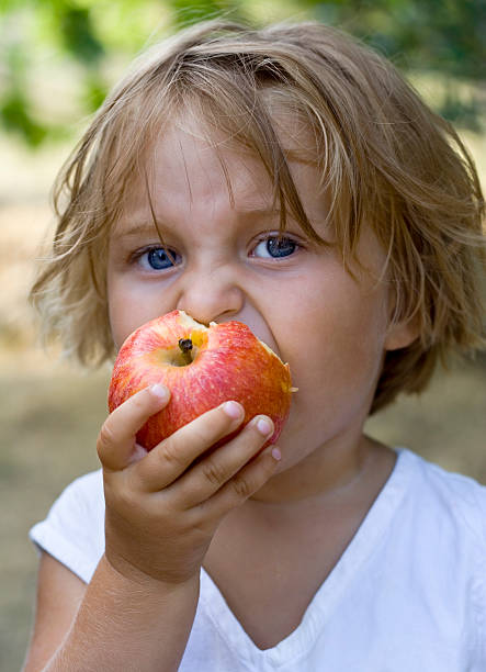 istock Girl Eating an Apple 172640844
