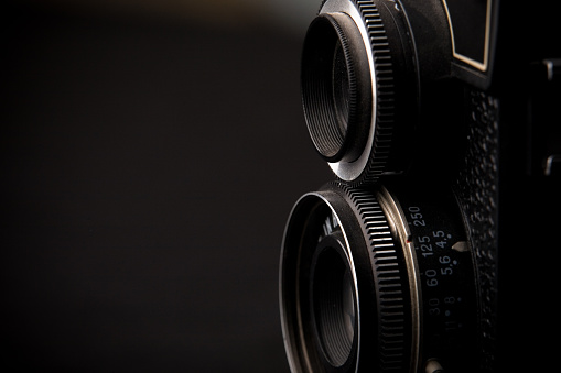 An old Russian Lomo twin lens reflex medium-format camera.  Shot on a black background
