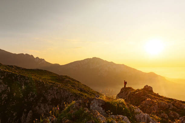 istock Person hiking at sunset 1726431097