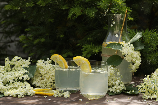 Elder flowers lemonade with flowers on the table outdoor