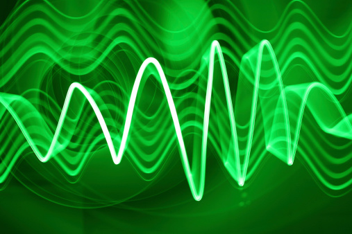 A green electon sound or light wave flying through the ether.