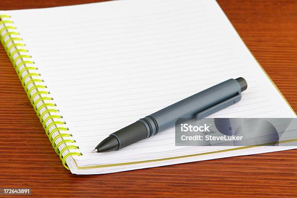 Yellow Notebook Stock Photo - Download Image Now - Desk, Essay - Document, Ballpoint Pen