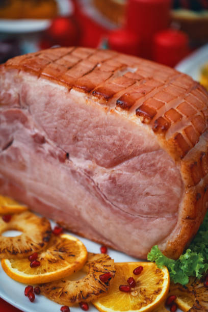 istock Christmas Dinner with Baked Glazed Ham and Various Vegetables 1726441665