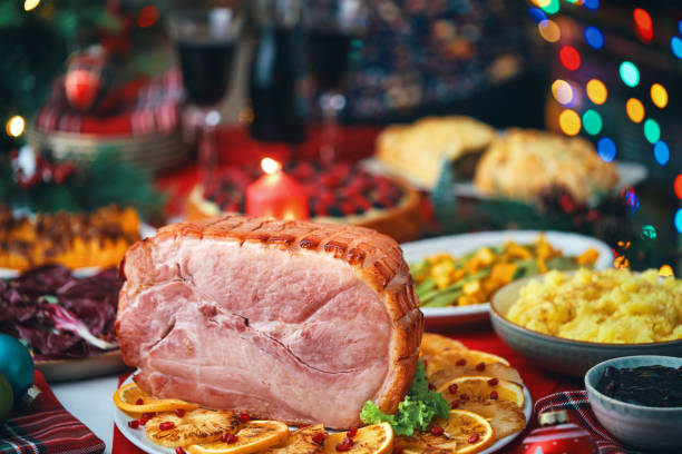 istock Christmas Dinner with Baked Glazed Ham and Various Vegetables 1726441668