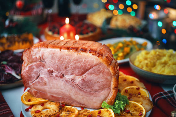 istock Christmas Dinner with Baked Glazed Ham and Various Vegetables 1726441670
