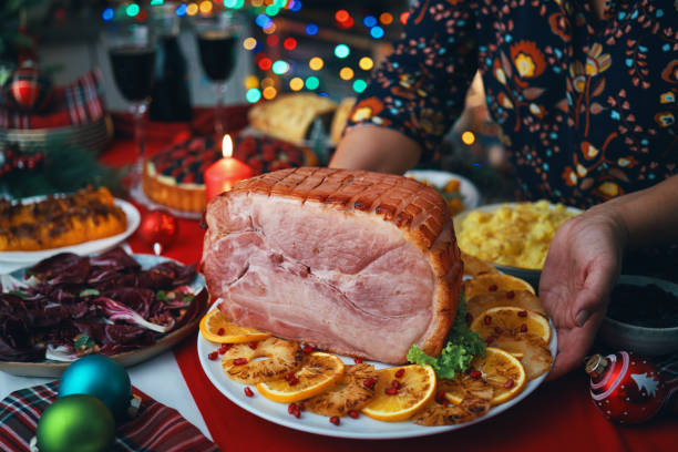 istock Christmas Dinner with Baked Glazed Ham and Various Vegetables 1726442193