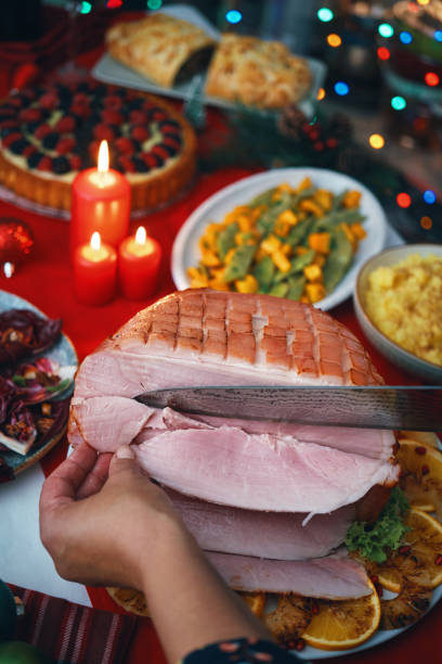 istock Christmas Dinner with Baked Glazed Ham and Various Vegetables 1726442213