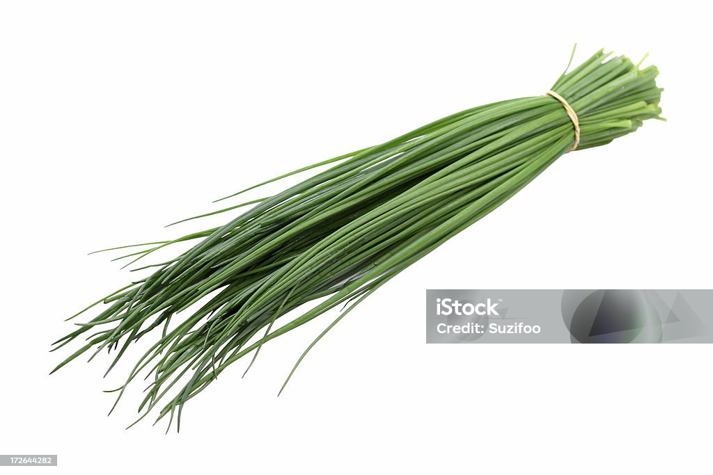 chives A bundle of fresh onion chives. Isolated on white.  Shallow depth of field. Chive Stock Photo