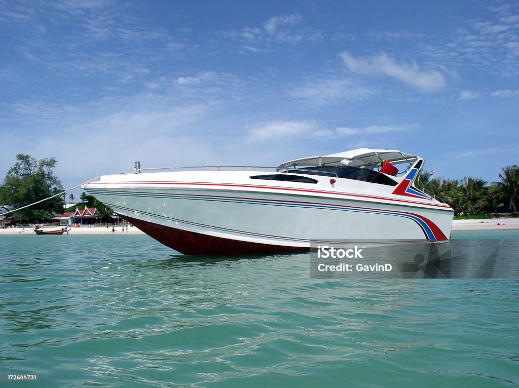 Speedboat anchored near beach in Thailand Speedboat in Thailand on a beautiful day in a beautiful bay in Koh Phangan. Ko Samui Stock Photo