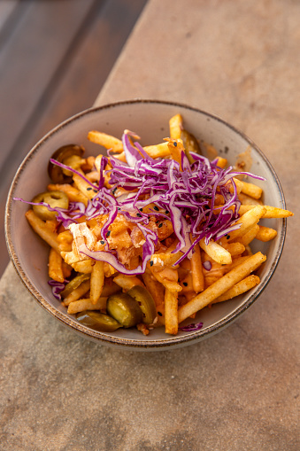 loaded fries with cheese, jalapenos and cabbage