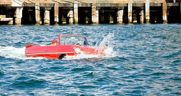 Amphibious auto on the ocean.