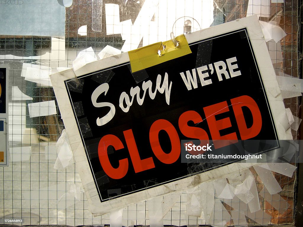 Sorry, we're closed Messy window full of tape. Closed Sign Stock Photo