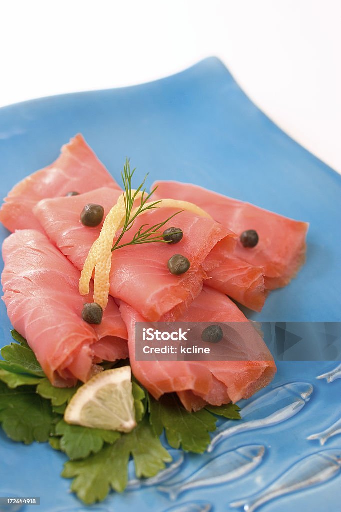 Lox Delicious paper thin slice lox style smoked salmon.  Perfect for a bagel. Appetizer Stock Photo