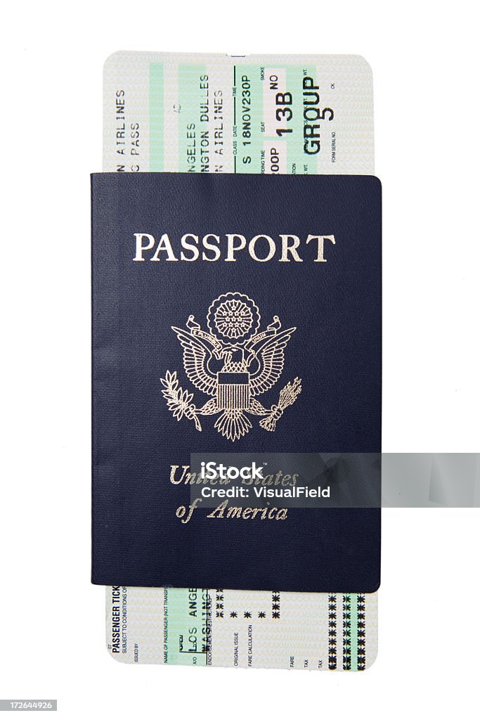 Blue passport with a white and green boarding pass Isolated image of US passport and boarding pass Airplane Ticket Stock Photo