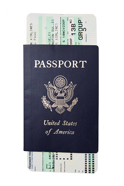 Blue passport with a white and green boarding pass Isolated image of US passport and boarding pass airplane ticket photos stock pictures, royalty-free photos & images