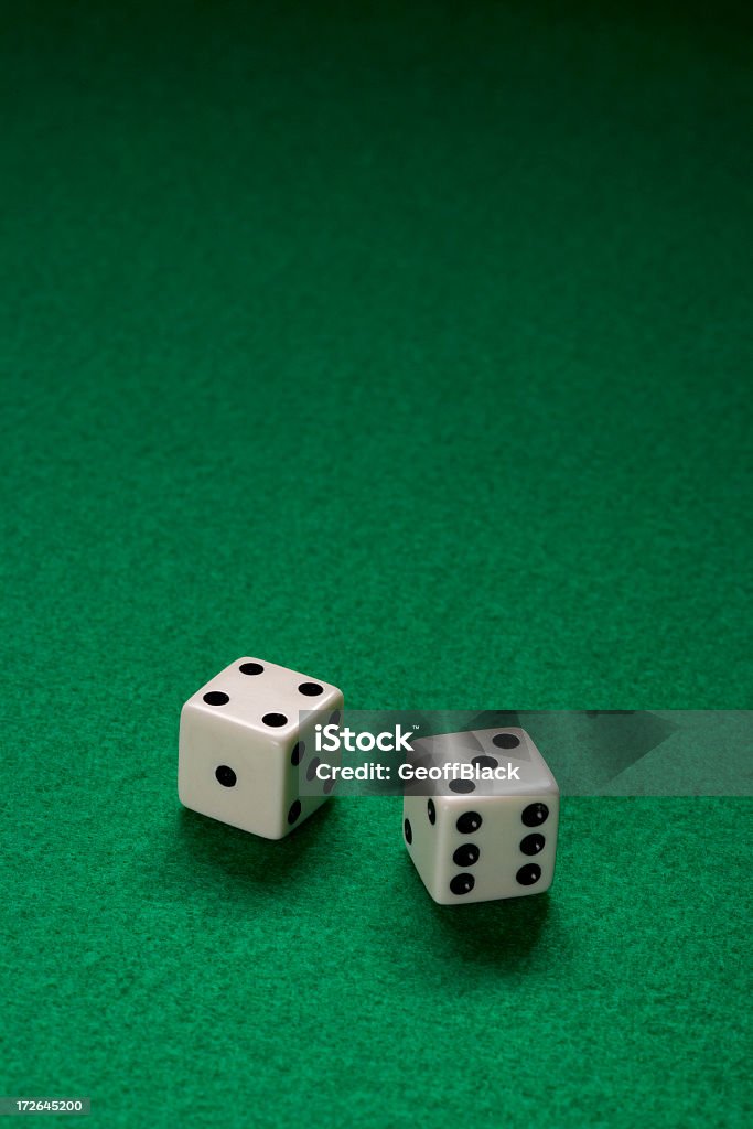 Says Pair of Dice on green felt table Luck Stock Photo