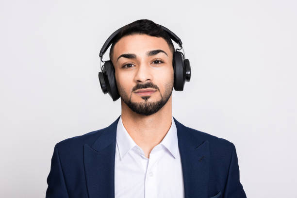 istock Turkish arabian indian buisnessman over grey background in studio isolated looking into distance portrait of sussessful concentrated guy handsome photo in studio isolated 1726453674