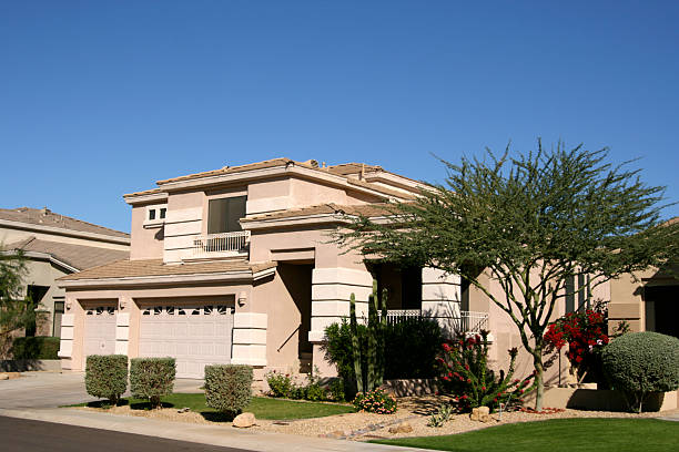 Arizona Luxury Home in Scottsdale Northwest Phoenix Arizona luxury home in Scottsdale Northwest Phoenix new suburb desert landscaping,acacia tree,rock yard, three car garage clear sky usa tree day stock pictures, royalty-free photos & images