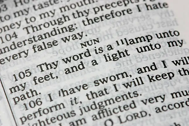 "Psalm 119:105 opened in the Bible (KJV)Thy word is a lamp unto my feet, and a light unto my path.Other images int his series:"