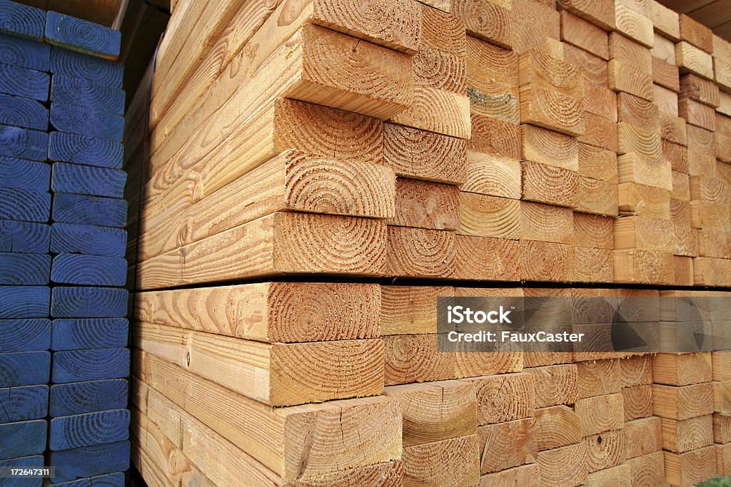 Stacks of Lumber "stacks of lumber, some painted blue" Backgrounds Stock Photo