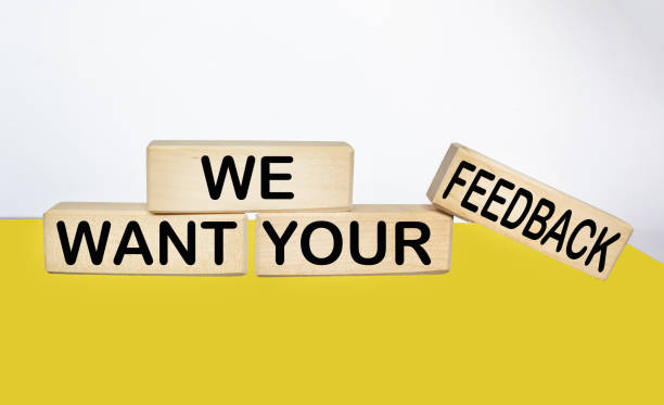 istock We need your feedback text on wooden block and yellow and white background 1726474544