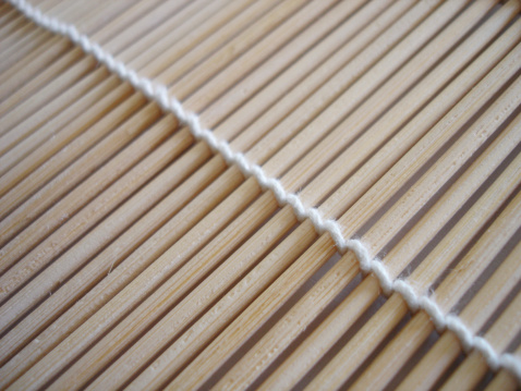 Angled shot of bamboo sushi roller.Please see some similar pictures from my portfolio: