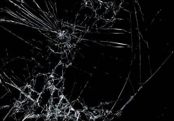 Shattered glass in dark background stock photo