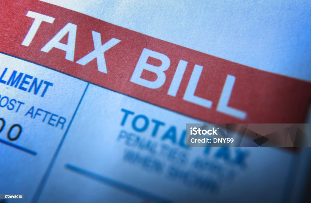 Tax Bill Close up of a tax bill. Single Word Stock Photo