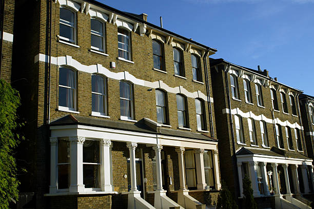 Classic Georgian Style Brick Building Facade with White Sash Windows and Traditional Architecture, panorama