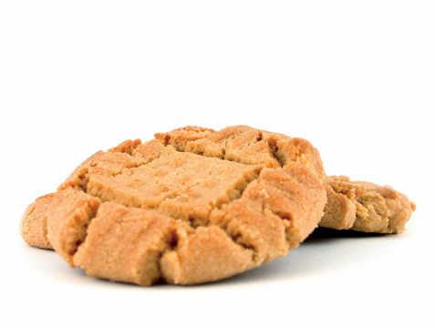 Three homemade peanut butter cookies. Shallow DOF with focus on the back part of the main cookie.